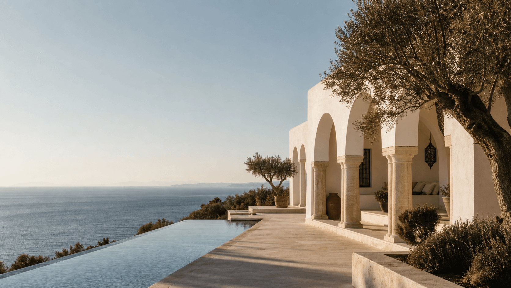 White Tunisian villa and infinity pool overlooking the Mediterranean